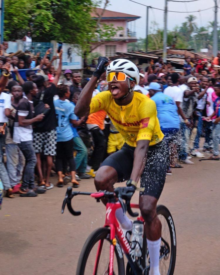 Ibrahim Jalloh in the leader's jersey among supporters